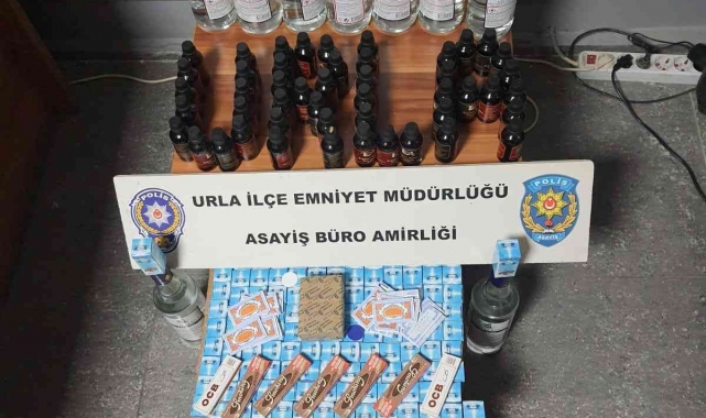 Urla'da kaçak içki ve sigara satışı yapan markete polis baskını
